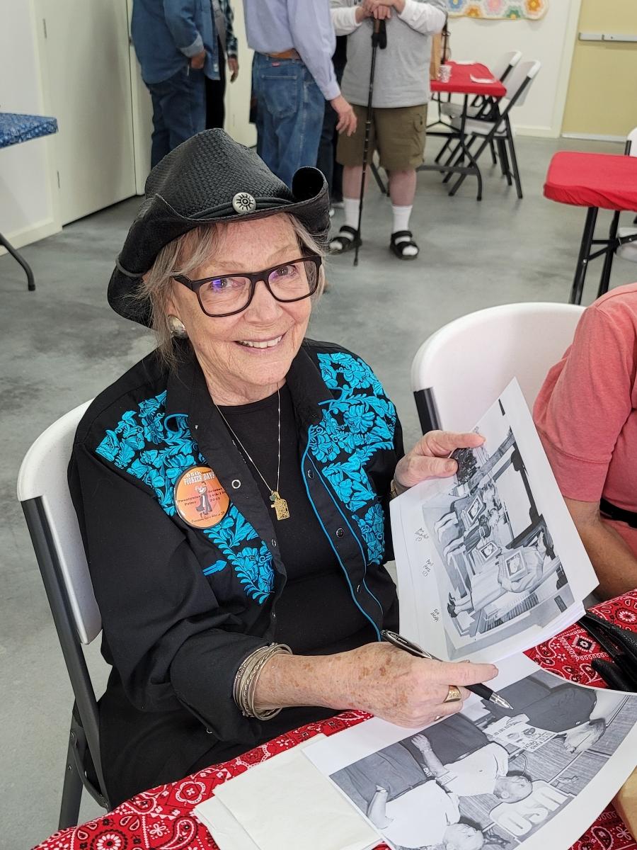 Courtesy Photo: OldTimers-2021-Ann.jpg - Ann (Underhill) Congdon finds herself as a child while identifying a historical photo during the 2021 Old Timers Gathering.